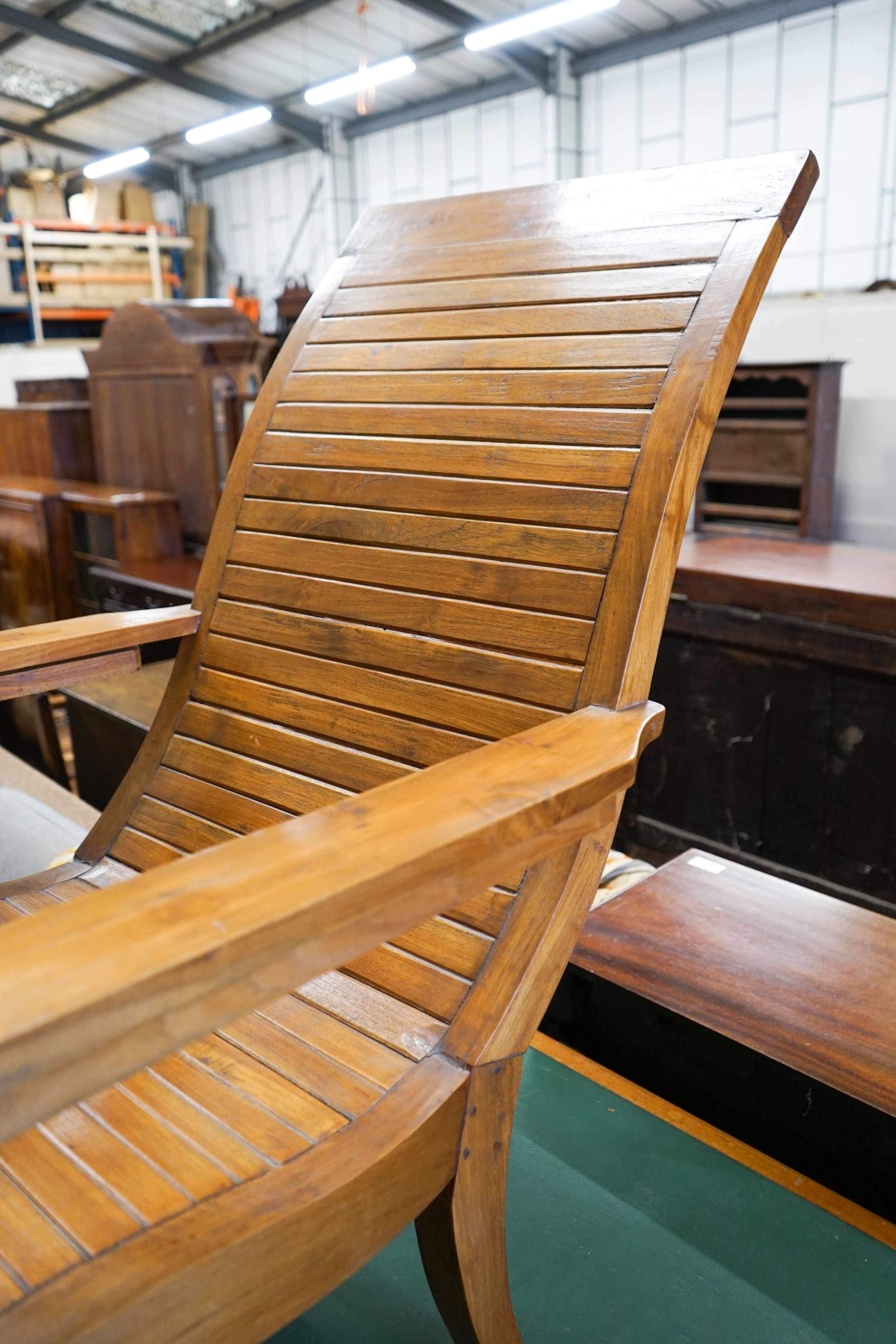 A hardwood plantation chair, width 73cm, depth 110cm, height 104cm